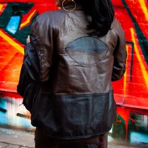 Monochromatic brown biker leather jacket.